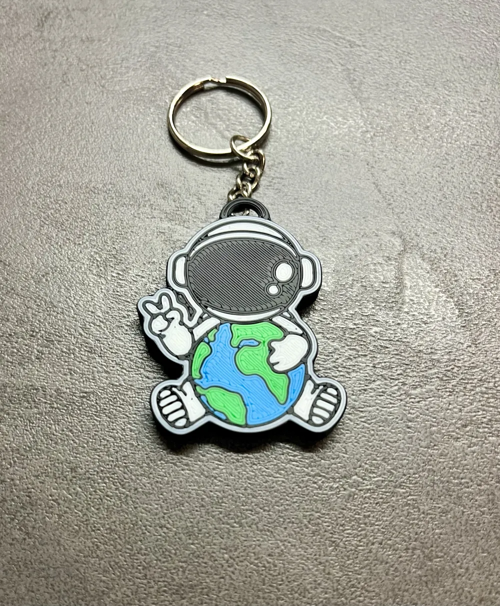 adorable astronaut keychain hugging planet Earth, photo 3 of 4 - adorable astronaut keychain hugging planet Earth Generative Art