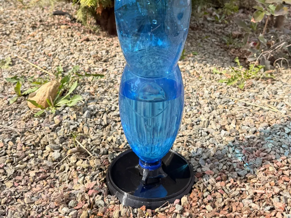 Bird drinker, bird bath, drinking bowl for birds.