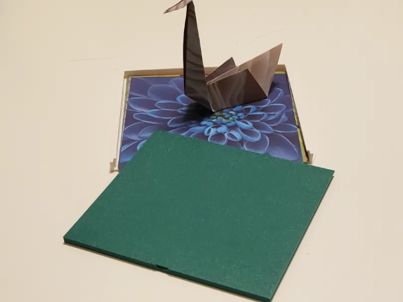 Small origami paper holder for backpack