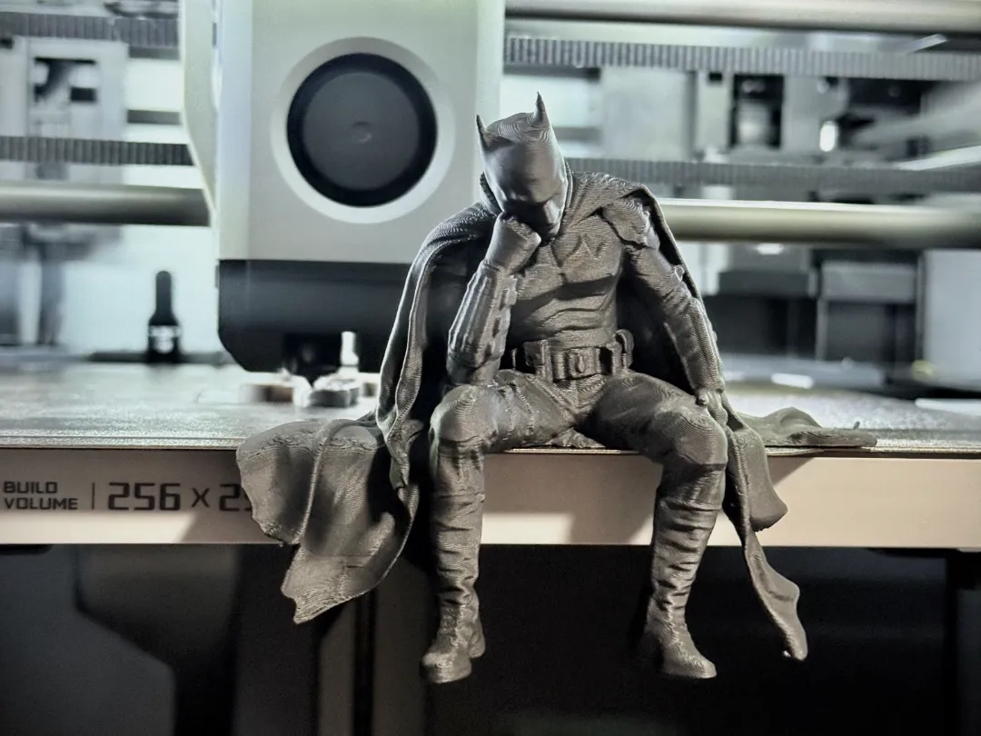Sad Batman sitting on a Ledge Figurine!