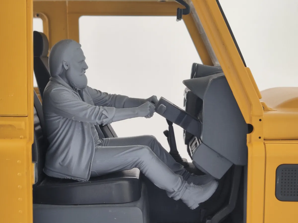 Driving figure older man with beard and lose coat