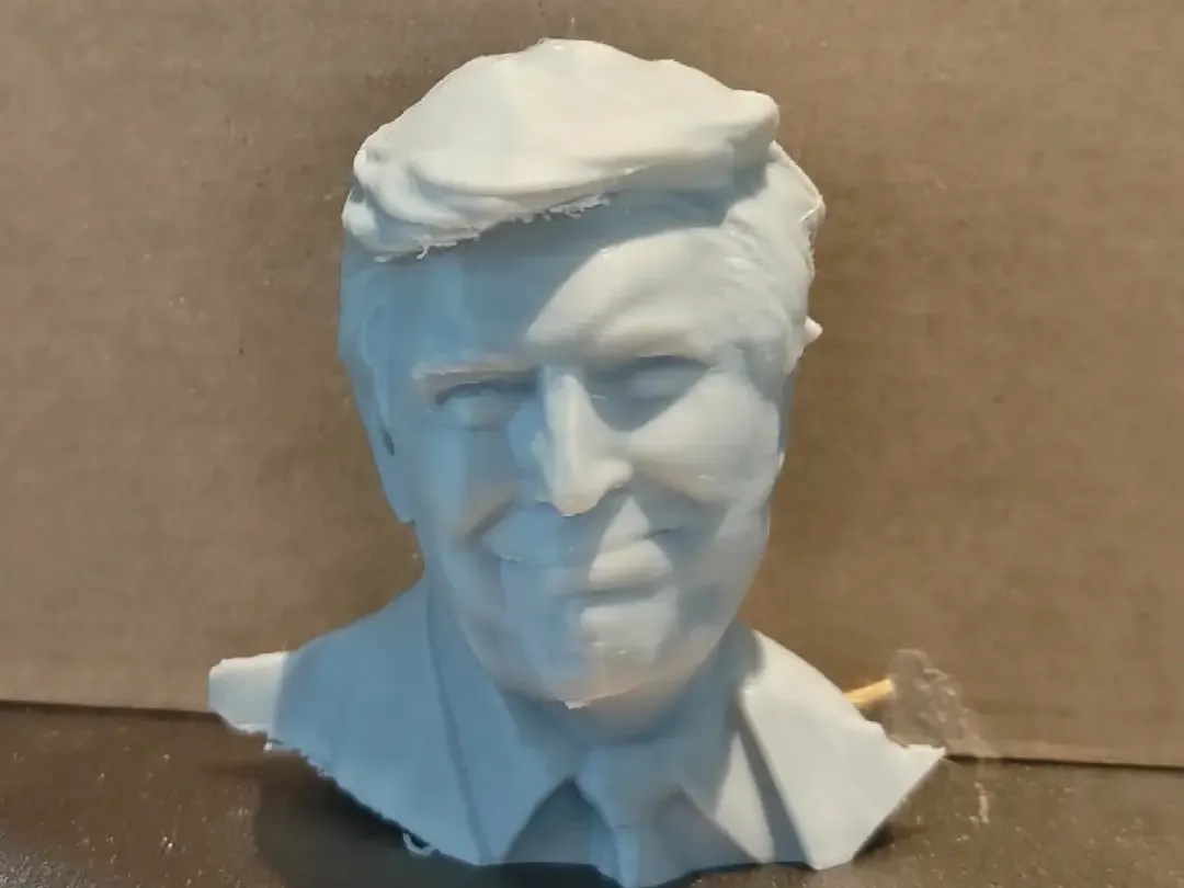 Two Donald Trump Head Sculptures