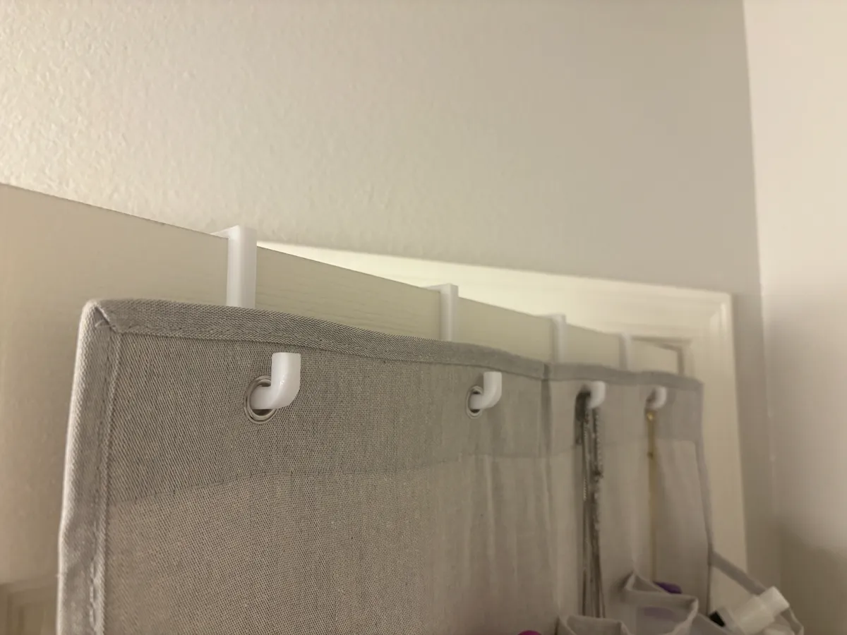 Over the door pocket organizer hooks