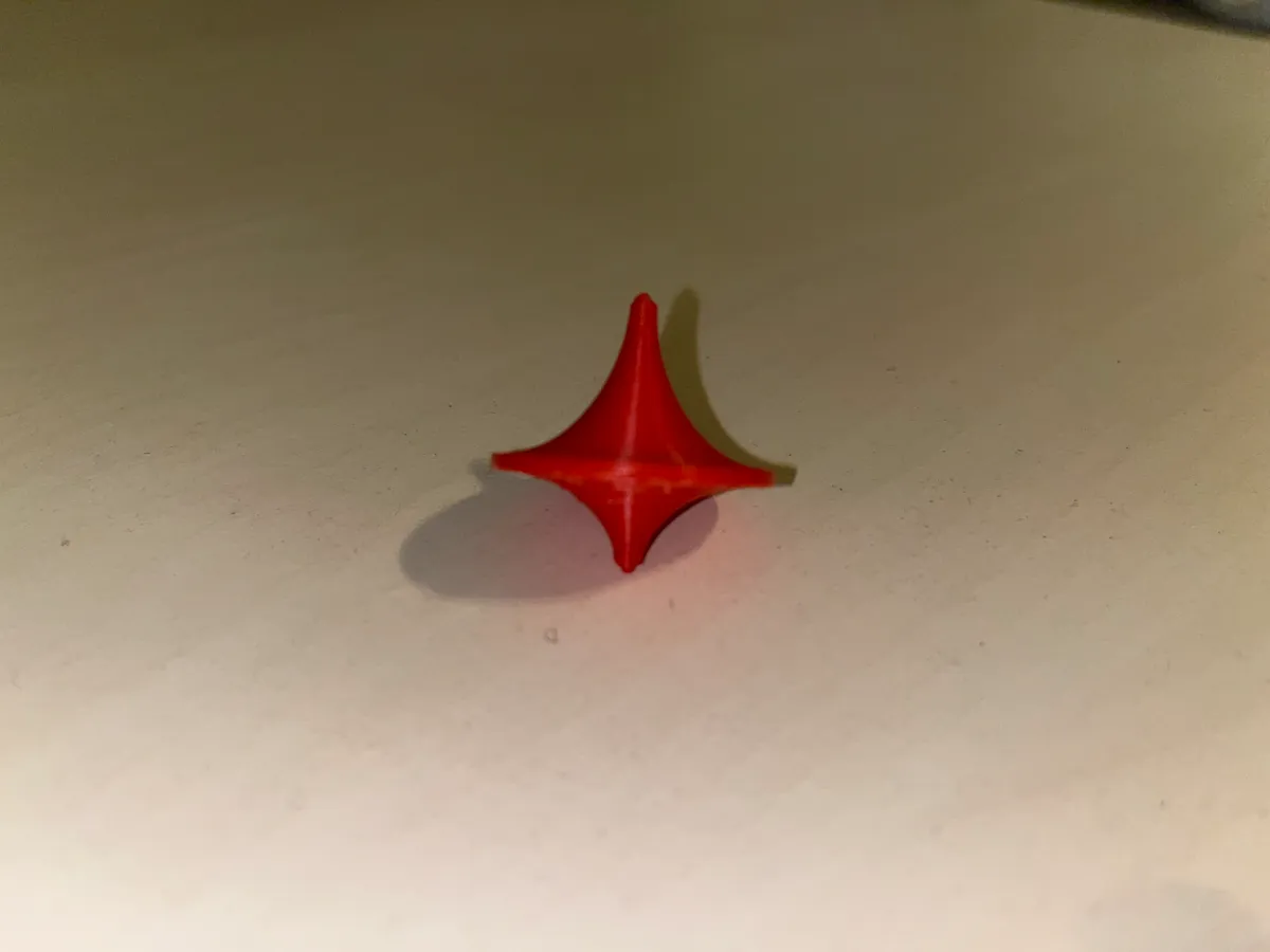 classic red plastic spinning top
