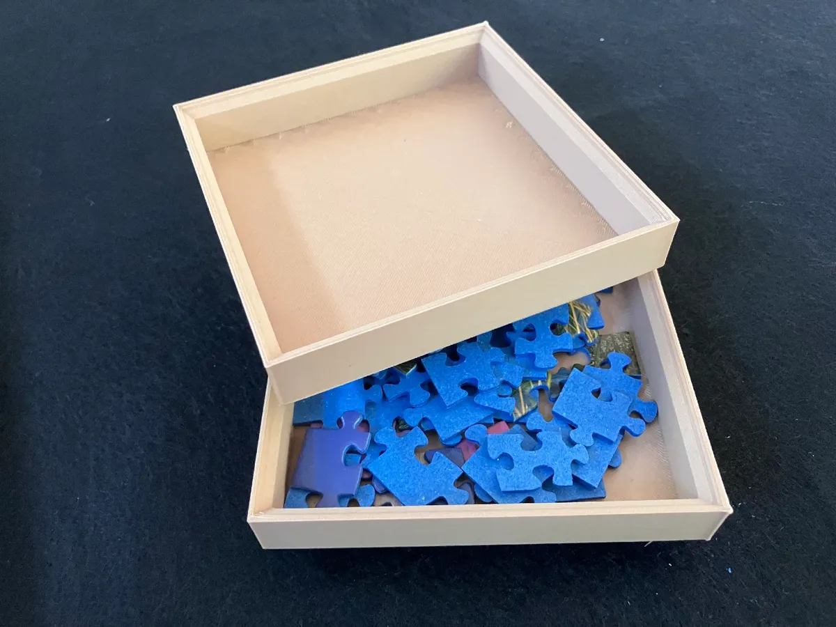 Stackable puzzle piece storage box