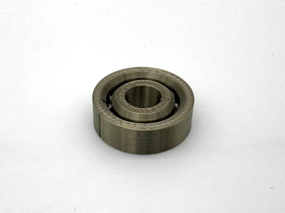 608 ball bearing (spins smoothly just off the bed)