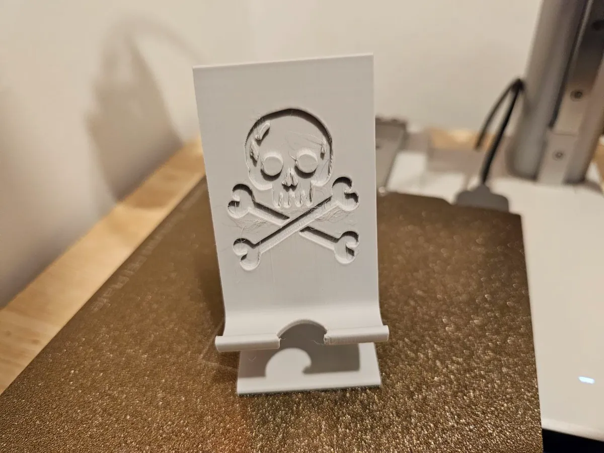 Skull and Crossbones Pirate Phone Stand, photo 4 of 4 - Skull and Crossbones Pirate Phone Stand Household