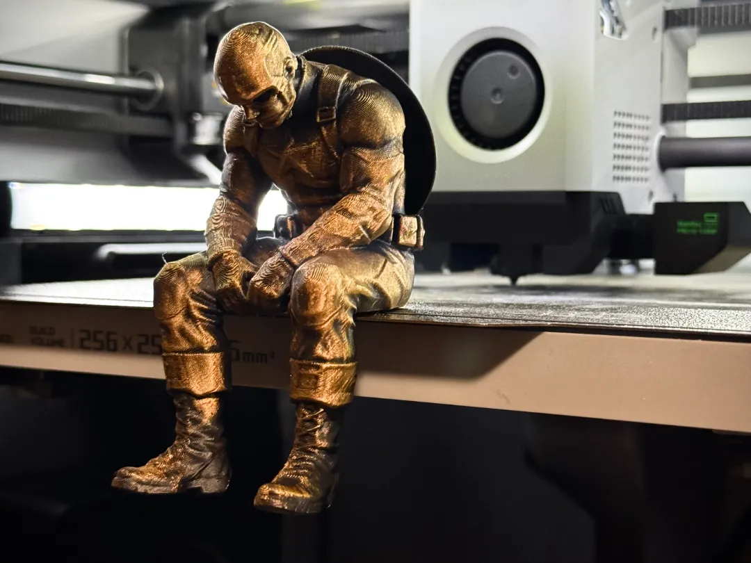 Sad Captain America Figurine sitting on a ledge!