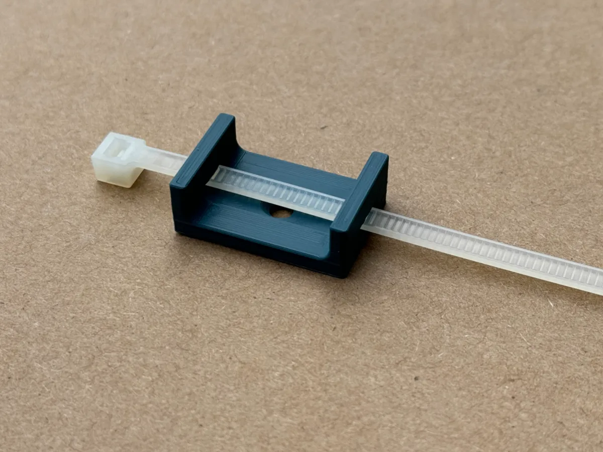 Wall mounted cable holder