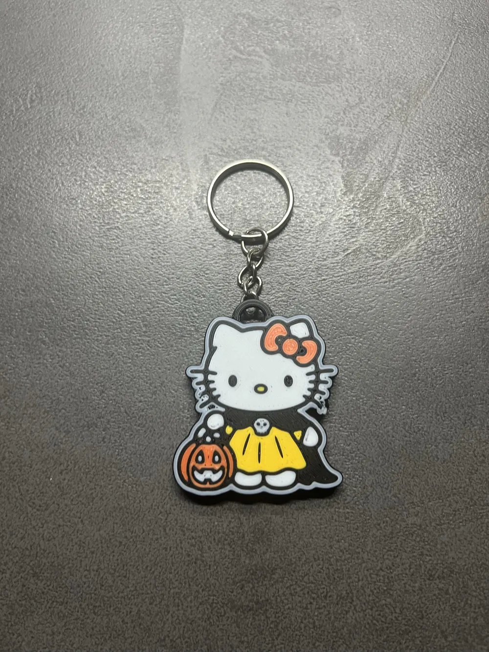 Hello Kitty in her Halloween costume keychain, photo 2 of 4 - Hello Kitty in her Halloween costume keychain Generative Art