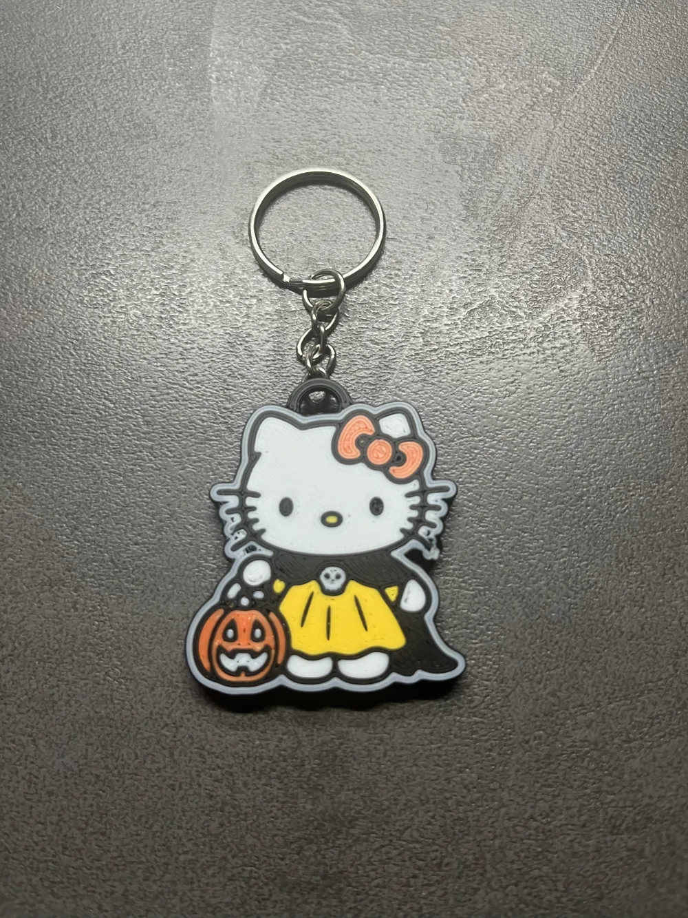 Hello Kitty in her Halloween costume keychain, photo 3 of 4 - Hello Kitty in her Halloween costume keychain Generative Art