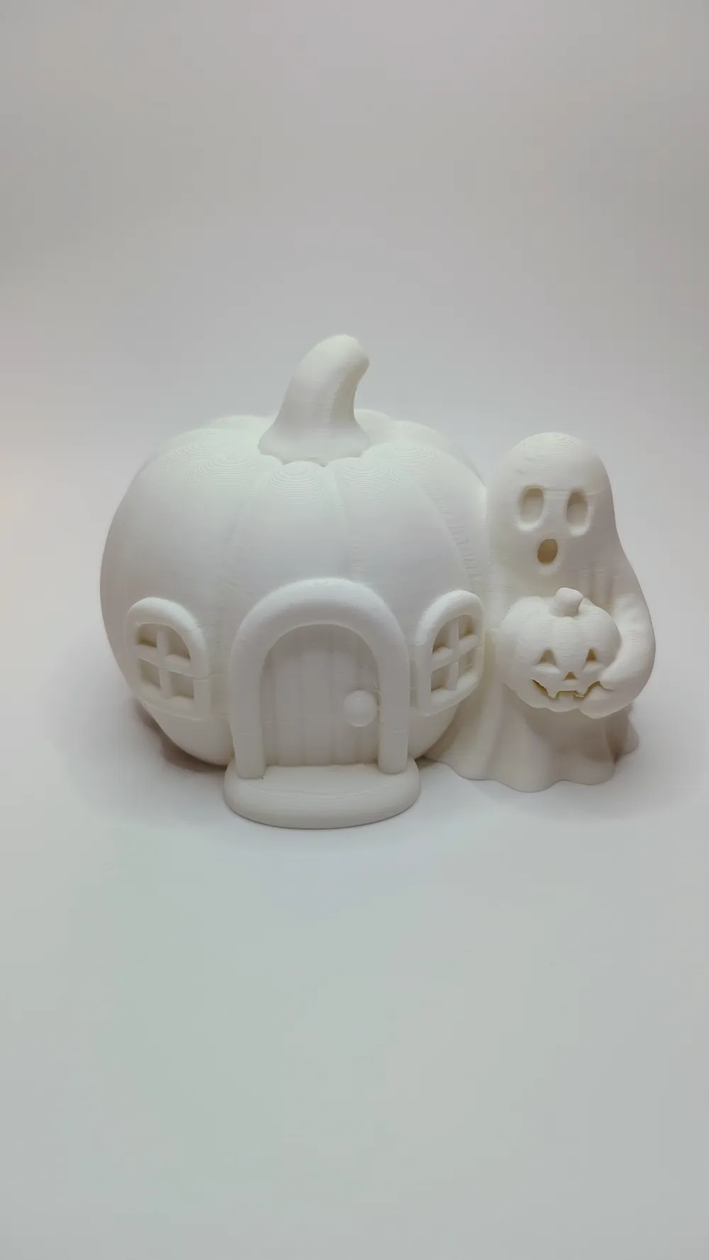 Glowing Pumpkin House with Ghost Visitor, photo 4 of 4 - Glowing Pumpkin House with Ghost Visitor Household