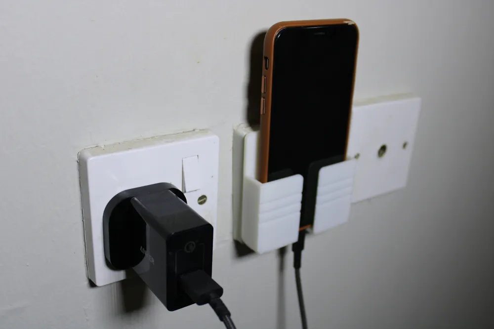 Phone holder in charger, photo 2 of 4 - Phone holder in charger Household