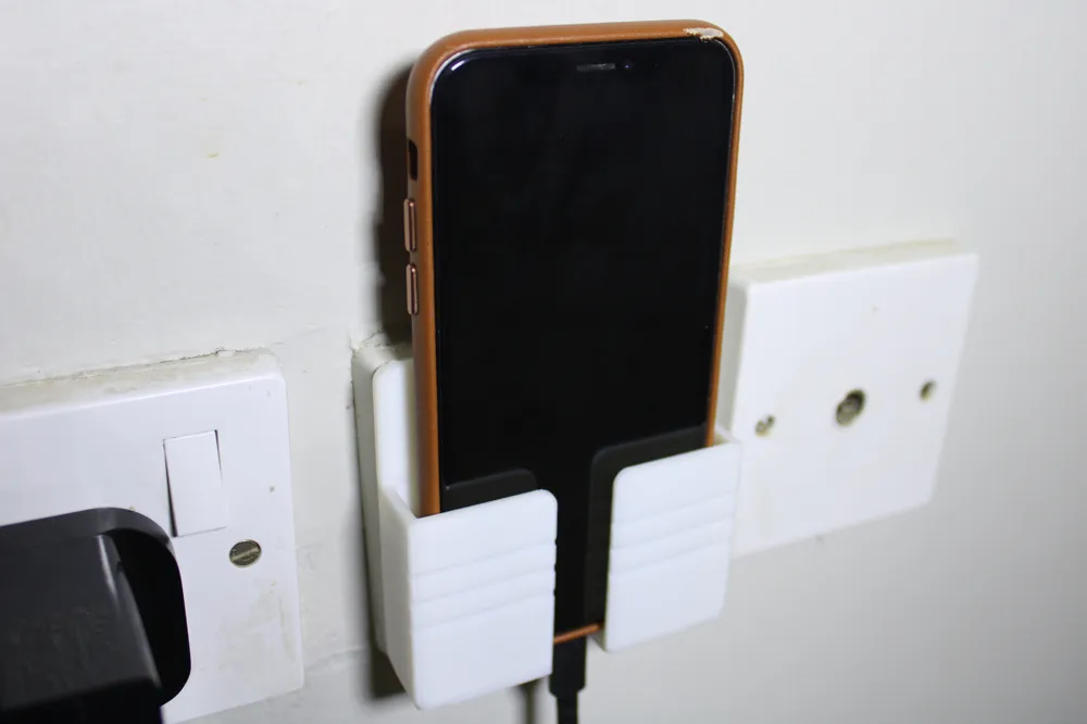 Phone holder in charger, photo 3 of 4 - Phone holder in charger Household