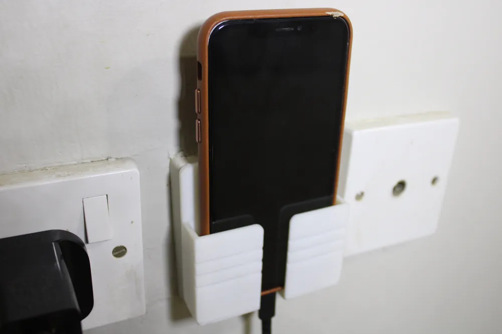 Phone holder in charger, photo 4 of 4 - Phone holder in charger Household