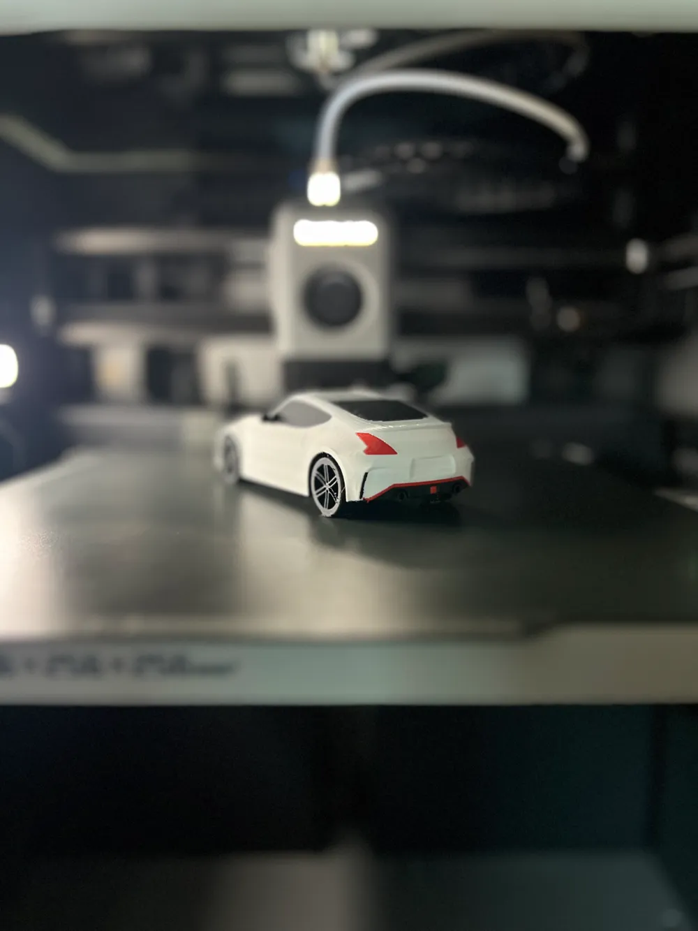 Nissan 370Z Nismo [Moving Wheels], photo 2 of 4 - Valve Caps & Wheel Accessories, car